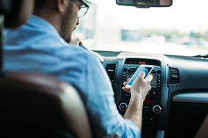 Battling Distracted Driving Injury Accidents