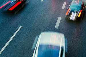 Three cars racing