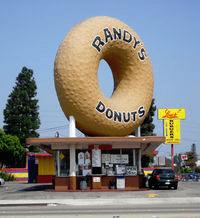 The landmark Randy Donuts is located in Inglewood, which is a city just southwest of downtown Los Angeles, Calif. Inglewood is also home to the fabulous Forum, which used to host the Los Angeles Lakers and the Los Angeles Kings hockey team, but since has been converted into a beautiful venue for concerts.